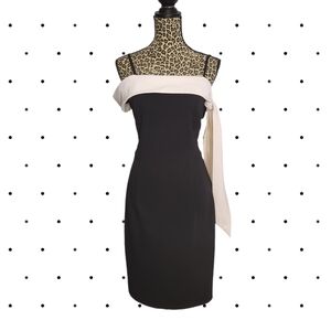 Black wiggle dress with white off shoulder collar bow